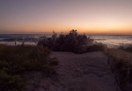 Sunrise surf over the beach